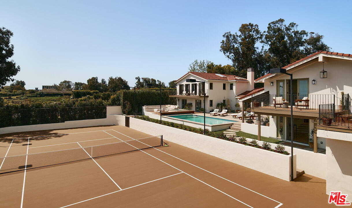 6930 Dume Drive Malibu, CA 90265 - Photo 15 of 34 a view of a tennis court with seating space
