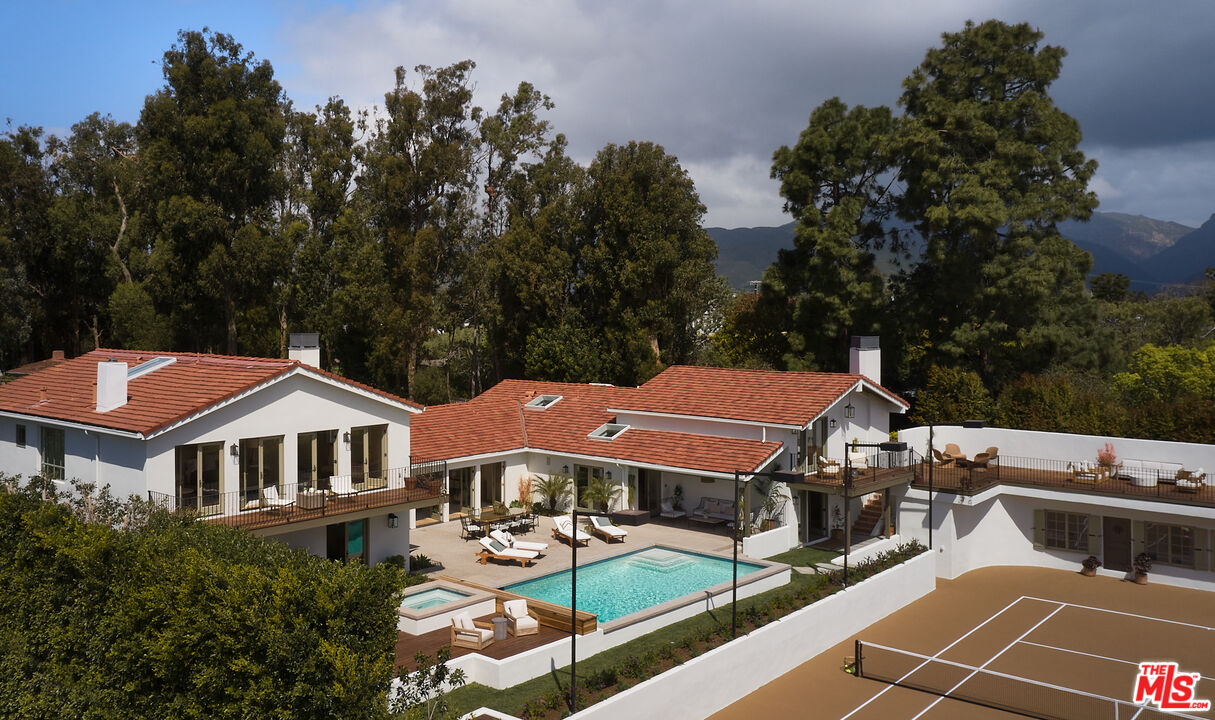6930 Dume Drive Malibu, CA 90265 - Photo 16 of 34 an aerial view of a house with swimming pool and sitting area