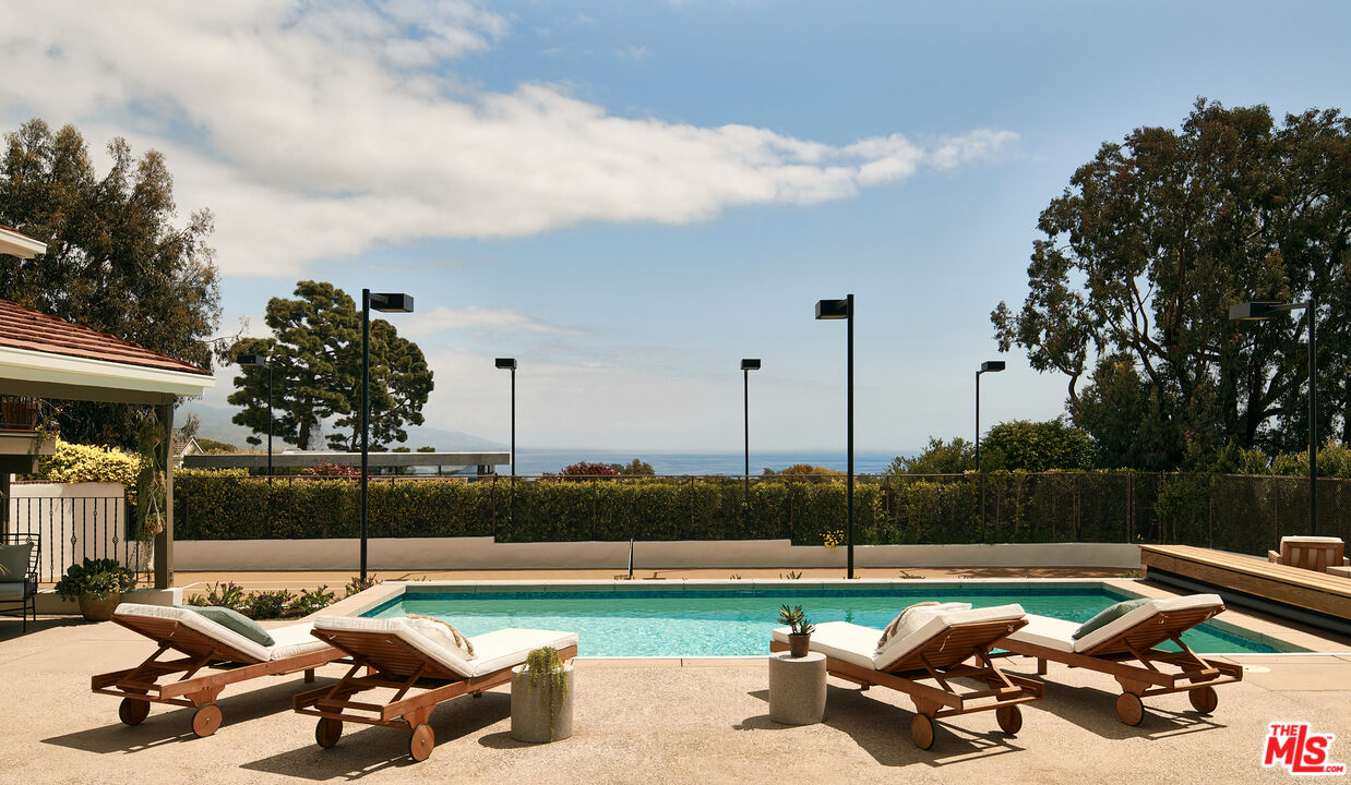 6930 Dume Drive Malibu, CA 90265 - Photo 18 of 34 a view of a terrace with chairs