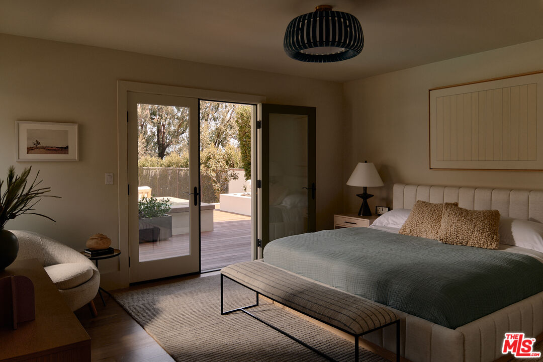 6930 Dume Drive Malibu, CA 90265 - Photo 24 of 34 a bedroom with a bed and a couch