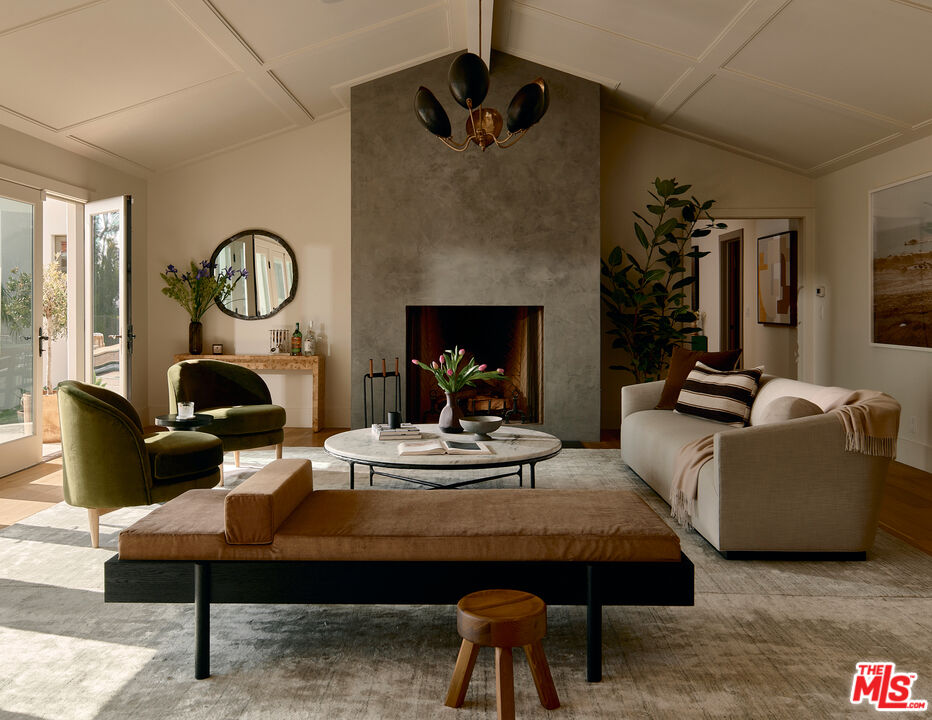 6930 Dume Drive Malibu, CA 90265 - Photo 4 of 34 a living room with furniture and a fireplace