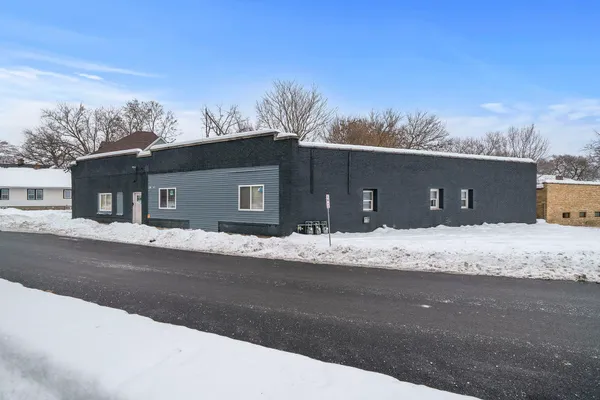 a house with trees in the background