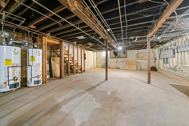 a view of an empty room with wooden roof