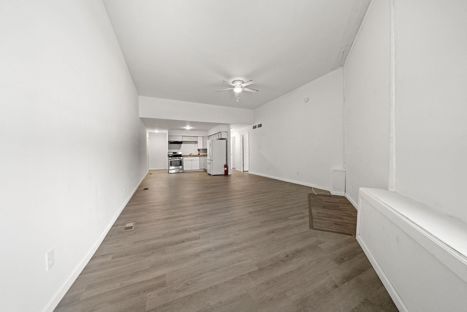 909-911 Ridge Avenue Rockford, IL 61103 - Photo 7 of 25 a view of empty room with wooden floor