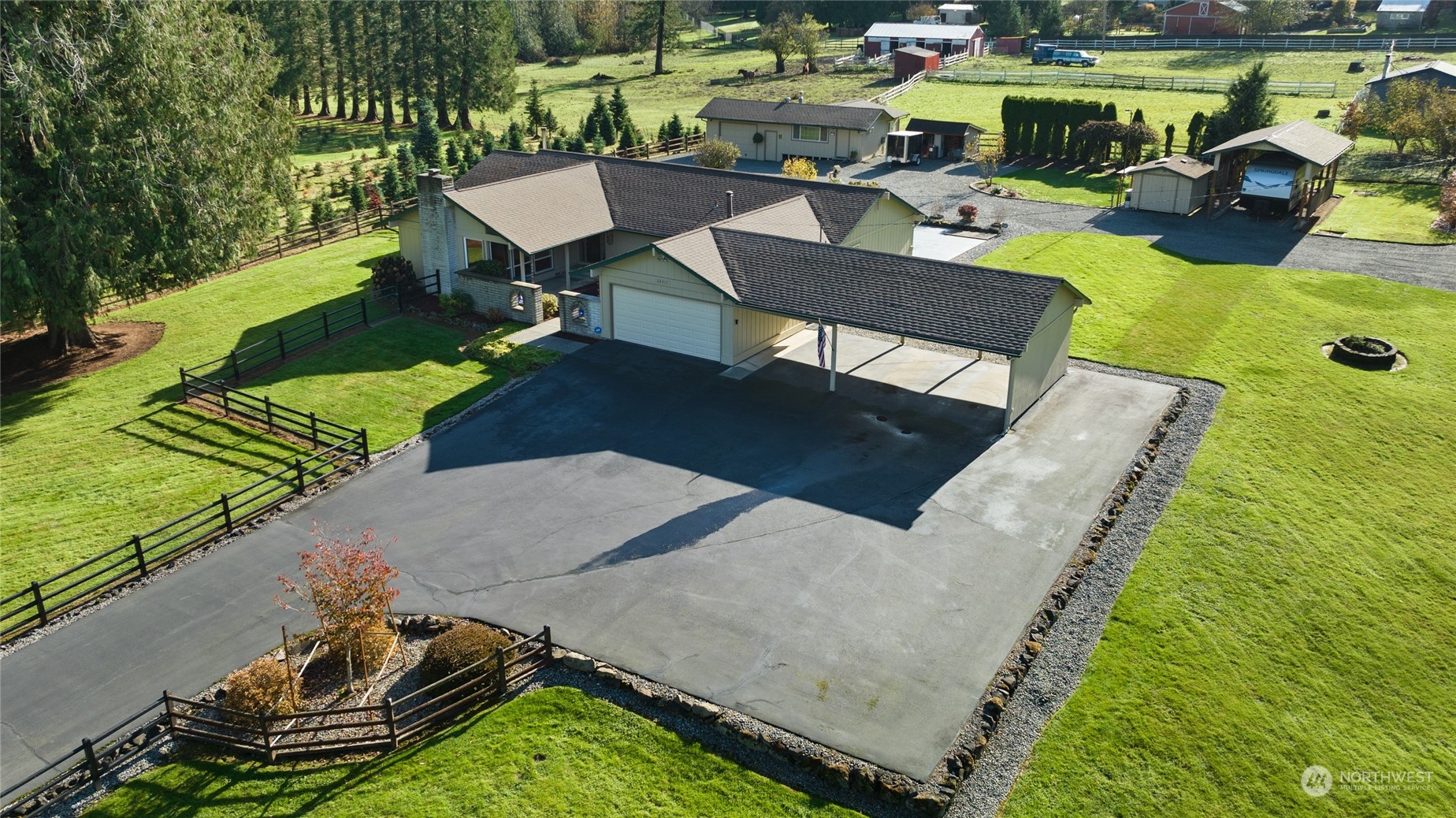 26417 Southeast 200th Street Maple Valley, WA 98038 - Photo 1 of 38 a view of a backyard with sitting area and outdoor kitchen