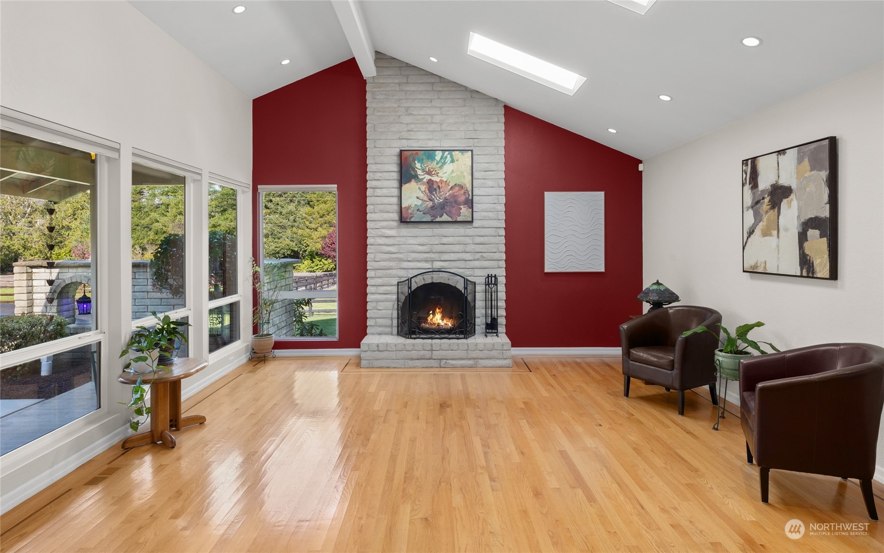 26417 Southeast 200th Street Maple Valley, WA 98038 - Photo 12 of 38 a living room with furniture and a fireplace