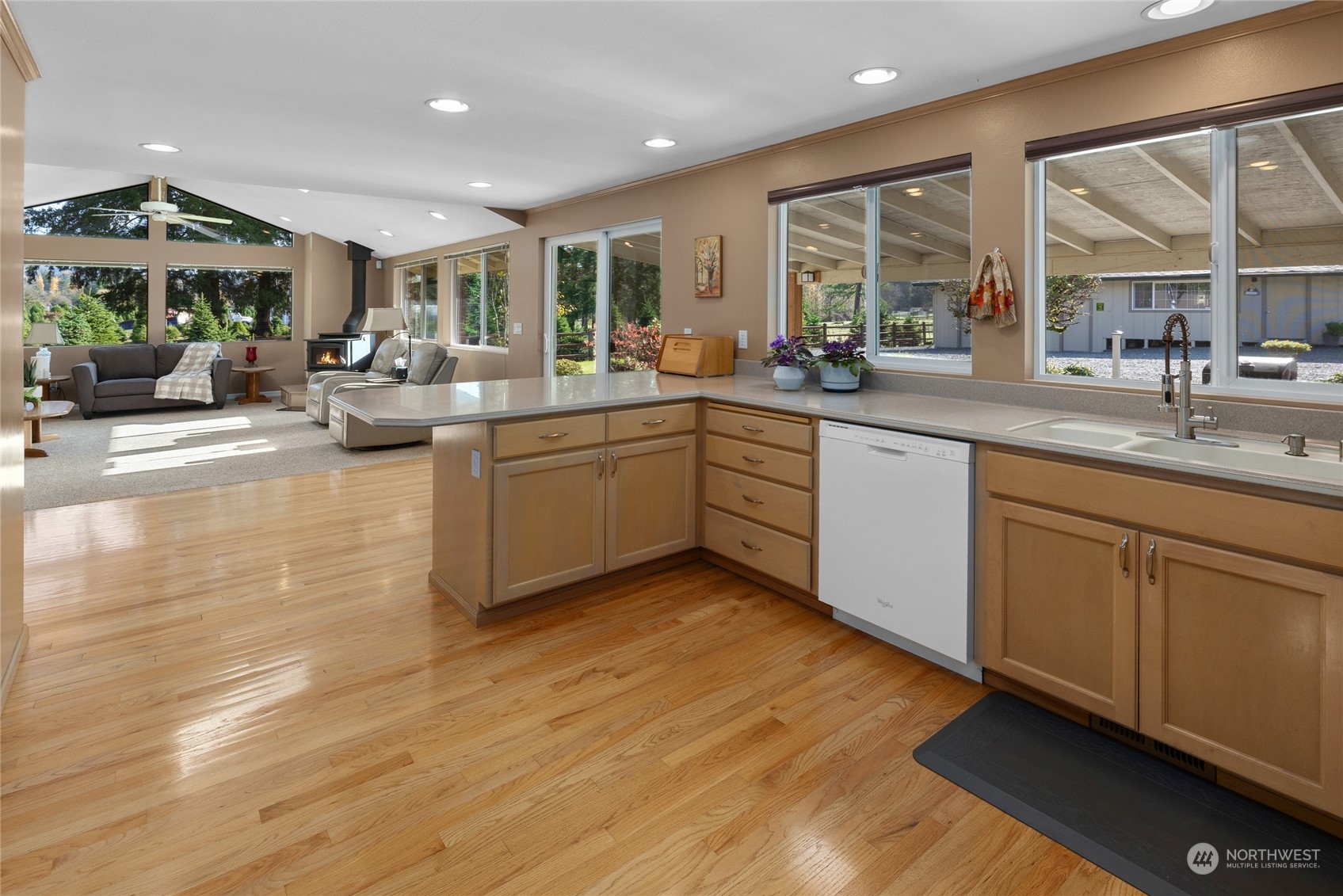 26417 Southeast 200th Street Maple Valley, WA 98038 - Photo 15 of 38 a large white kitchen with a large window