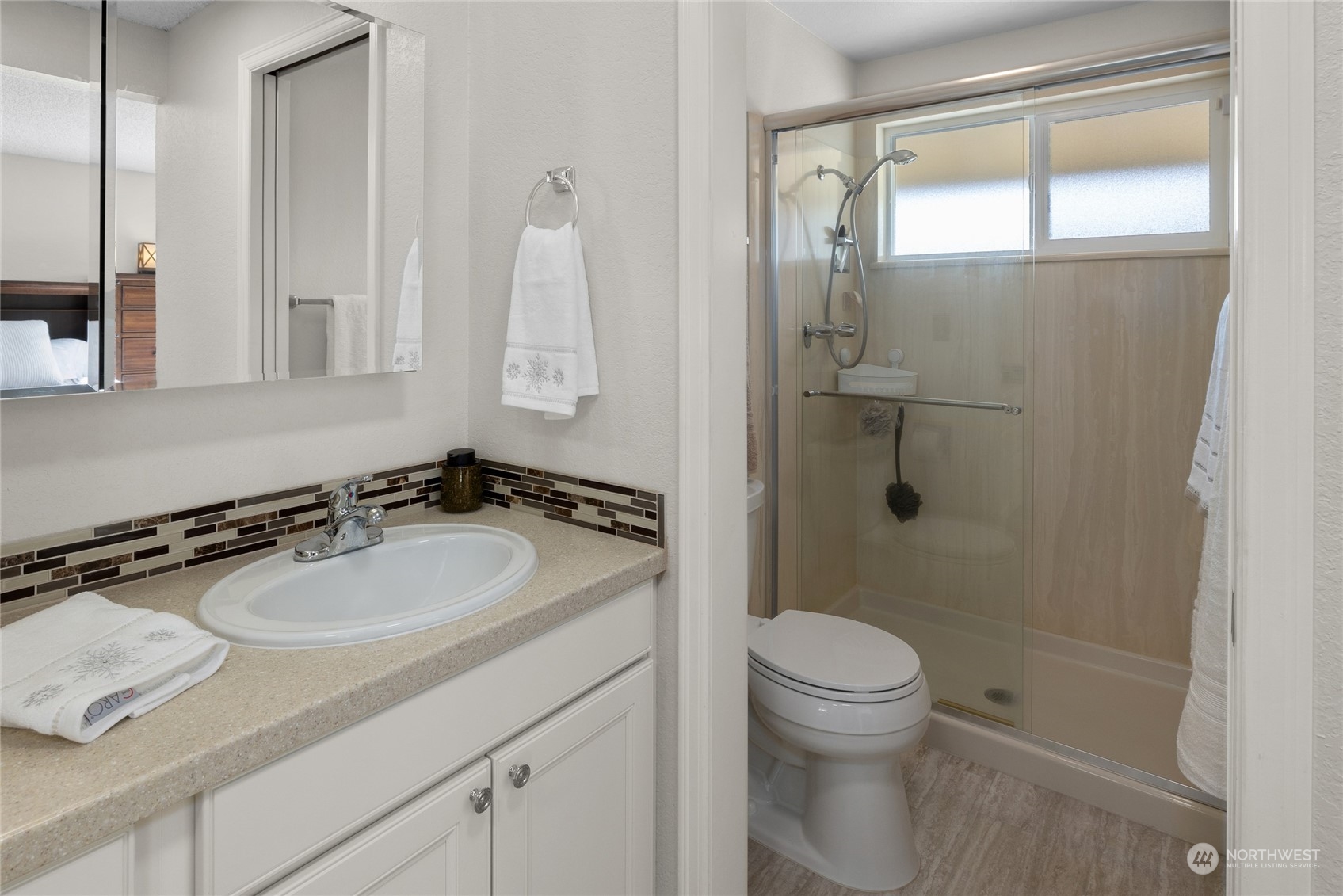 26417 Southeast 200th Street Maple Valley, WA 98038 - Photo 19 of 38 a bathroom with a sink a toilet and a mirror
