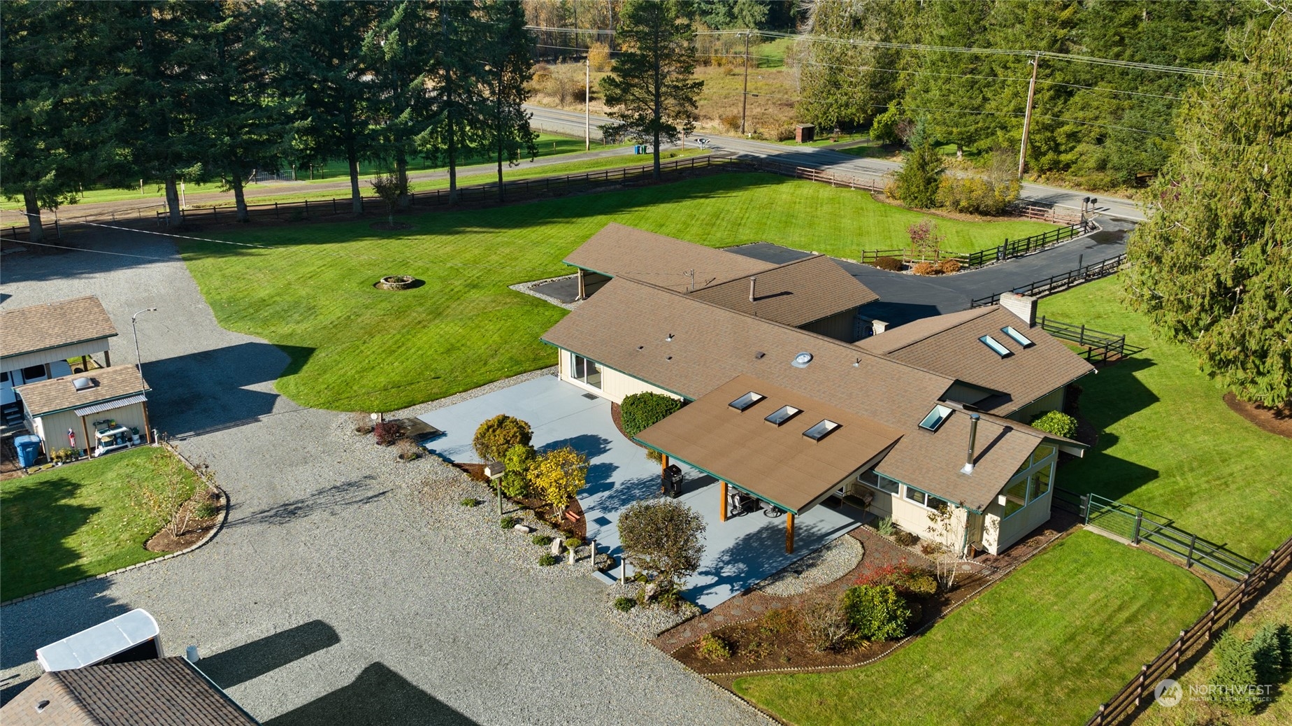 26417 Southeast 200th Street Maple Valley, WA 98038 - Photo 2 of 38 an aerial view of a house with a garden and swimming pool