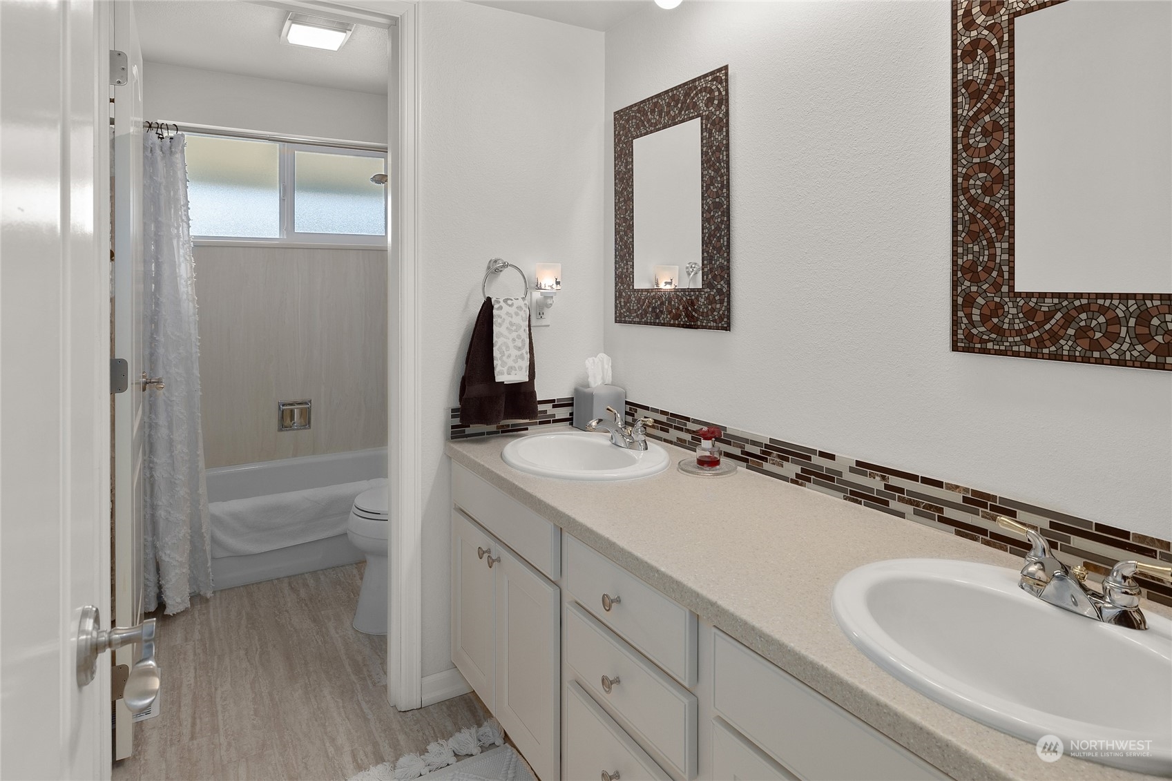 26417 Southeast 200th Street Maple Valley, WA 98038 - Photo 21 of 38 a bathroom with a sink a toilet and shower