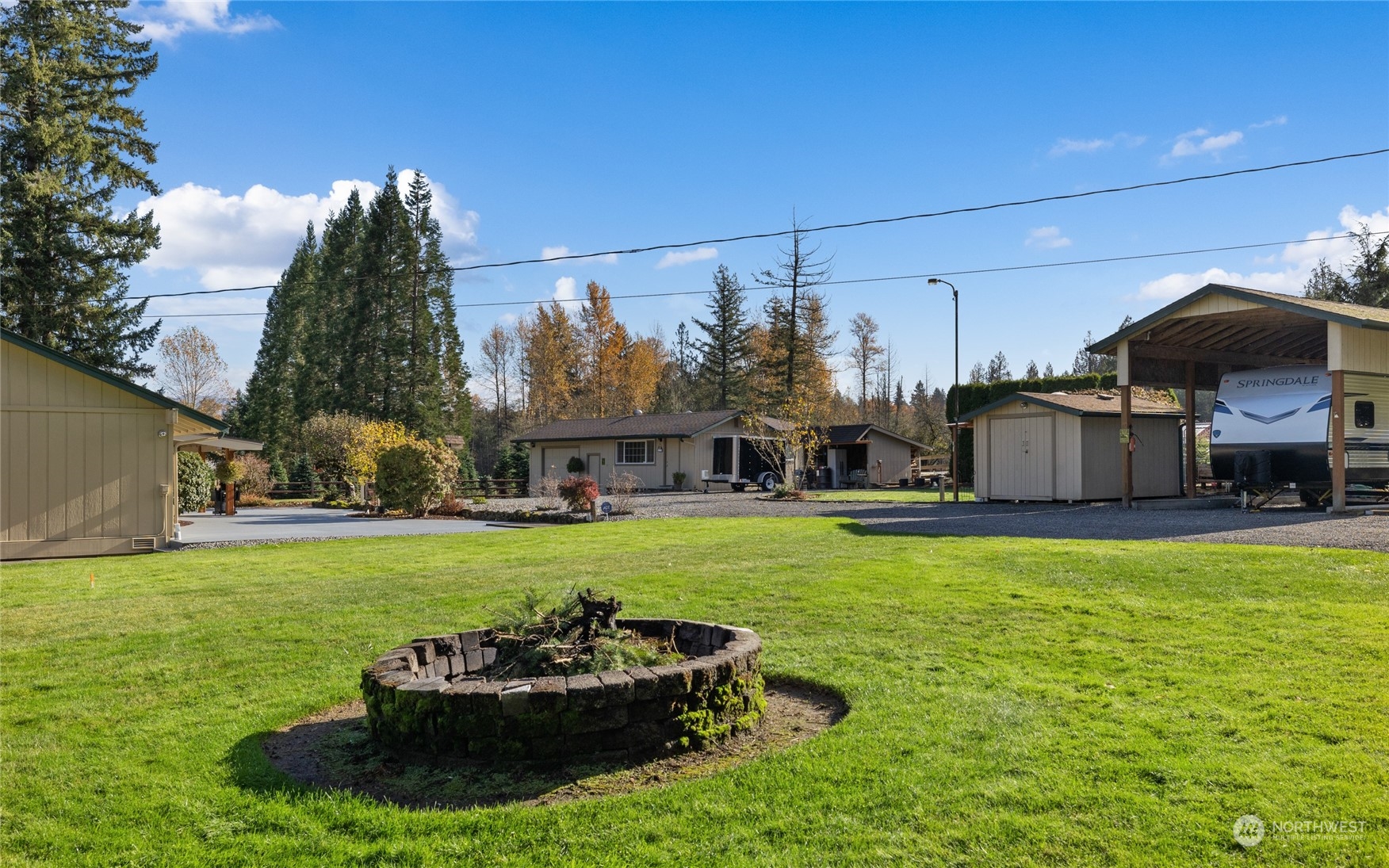 26417 Southeast 200th Street Maple Valley, WA 98038 - Photo 27 of 38 a view of a house with backyard and sitting area