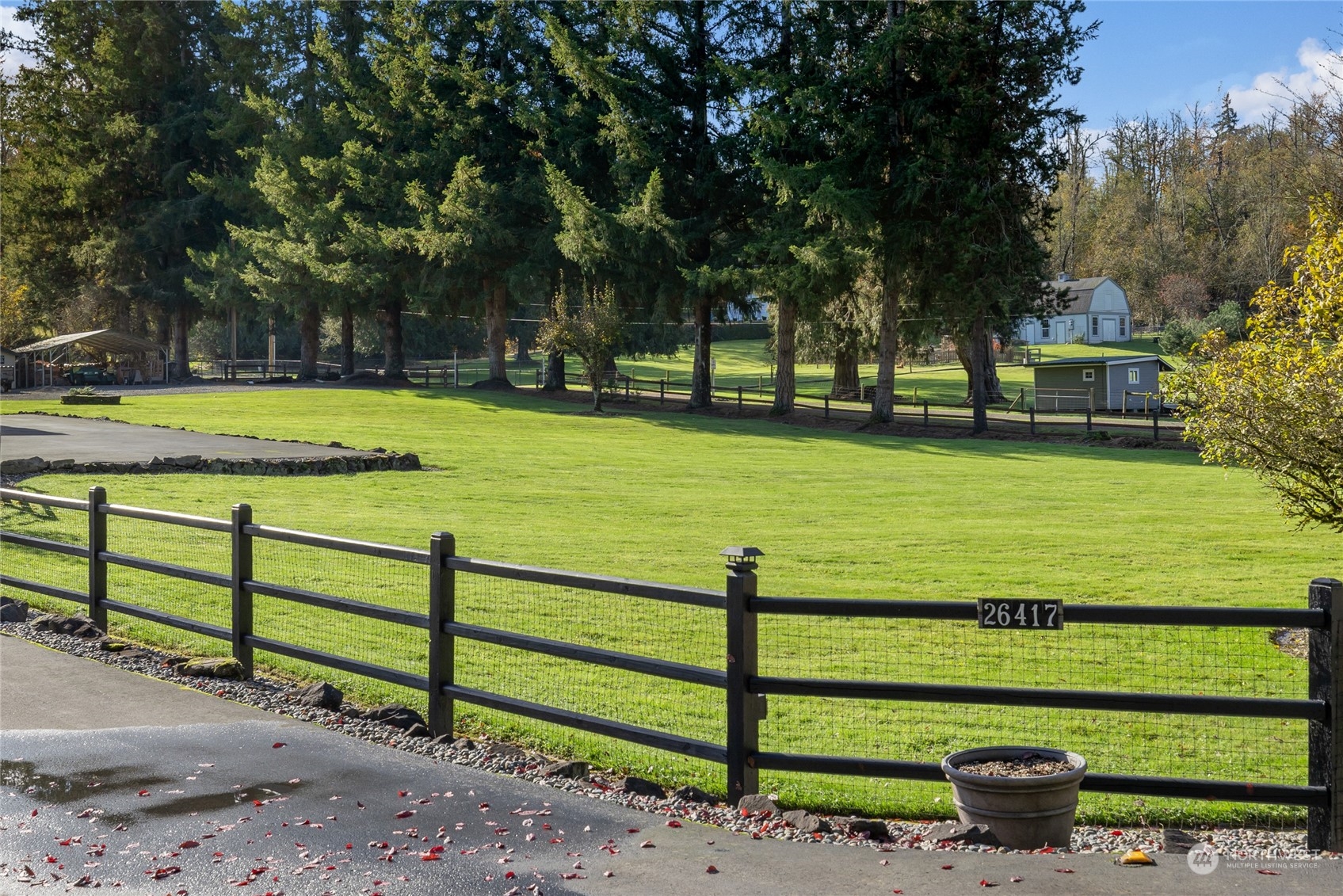 26417 Southeast 200th Street Maple Valley, WA 98038 - Photo 32 of 38 a view of a garden with swimming pool