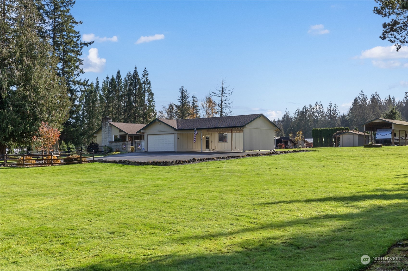 26417 Southeast 200th Street Maple Valley, WA 98038 - Photo 35 of 38 a front view of a house with garden