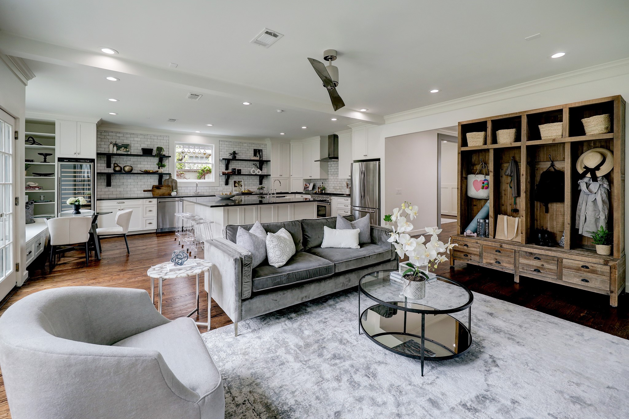 2027 Branard Street Houston, TX 77098 - Photo 13 of 36 a living room with furniture and a flat screen tv