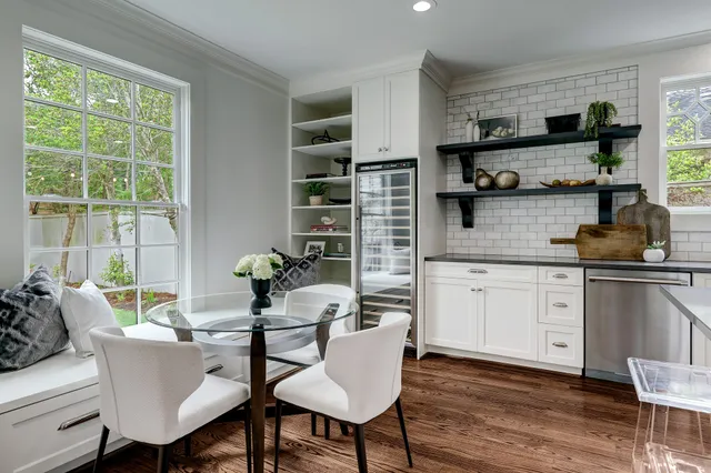 a kitchen with a table and chairs