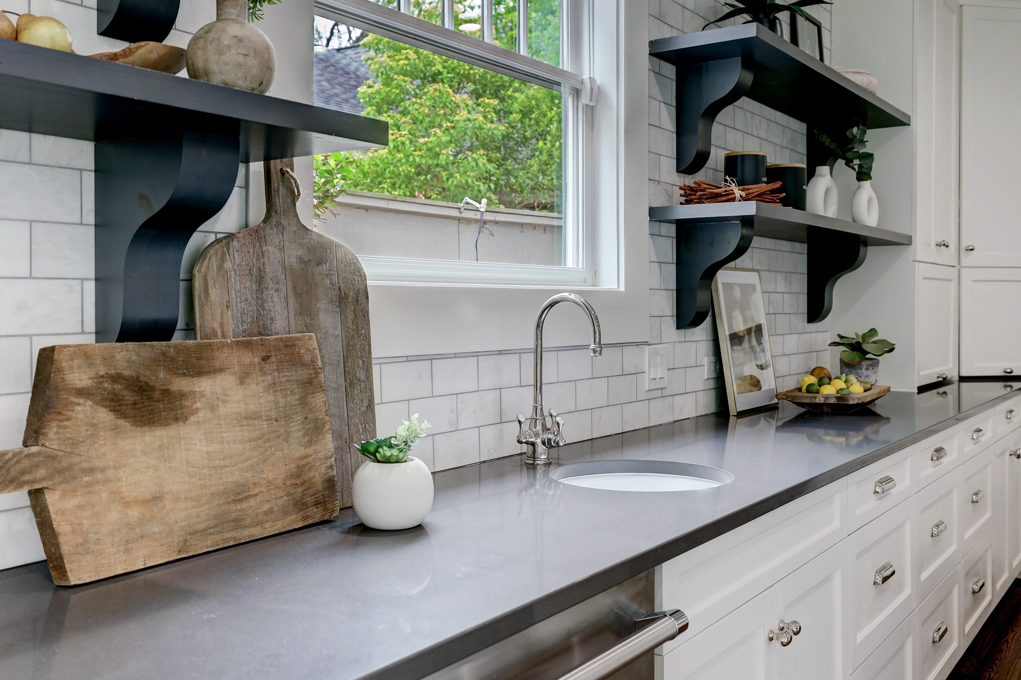 2027 Branard Street Houston, TX 77098 - Photo 18 of 36 a kitchen counter with a potted plant on it