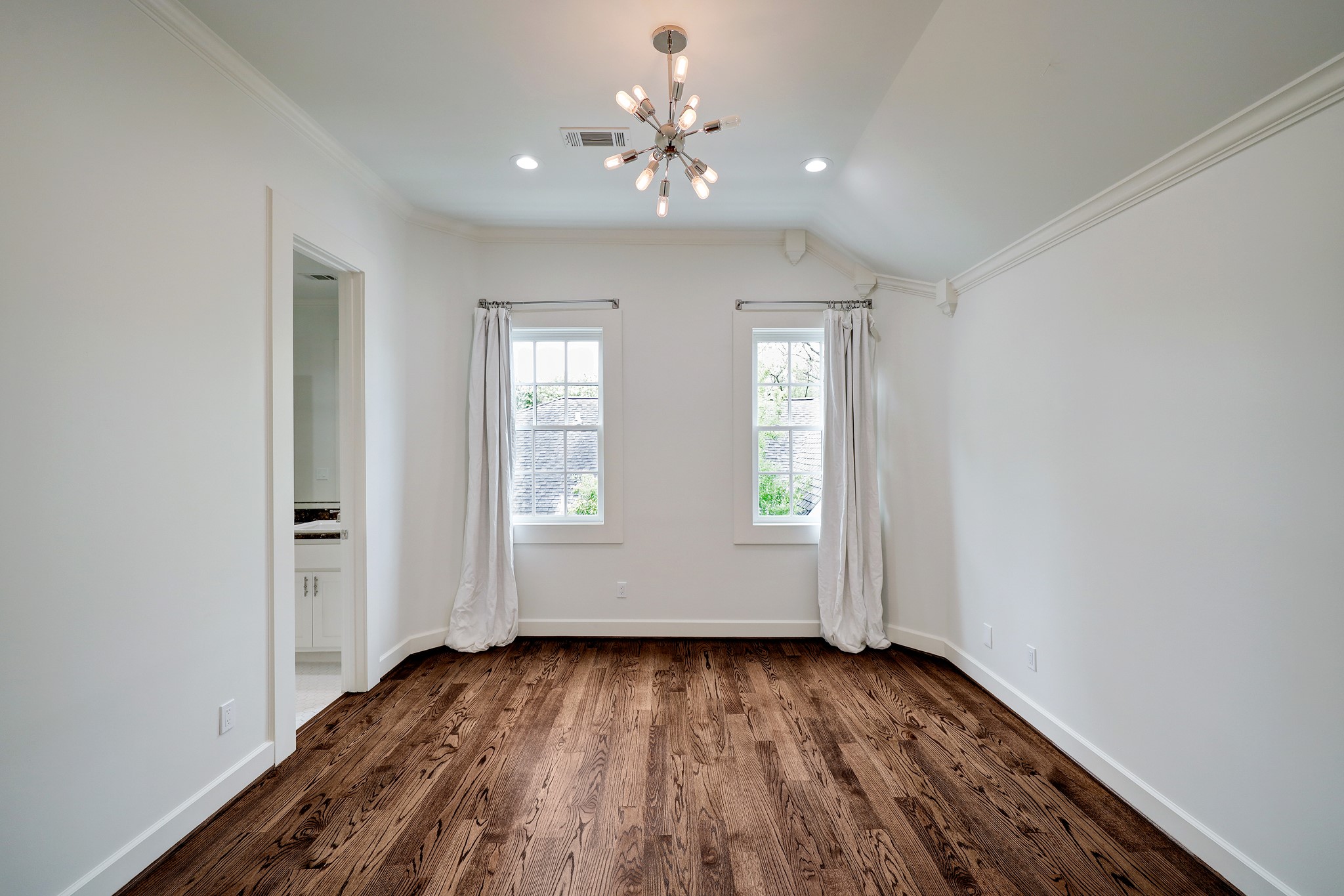 2027 Branard Street Houston, TX 77098 - Photo 22 of 36 wooden floor in an empty room with a window