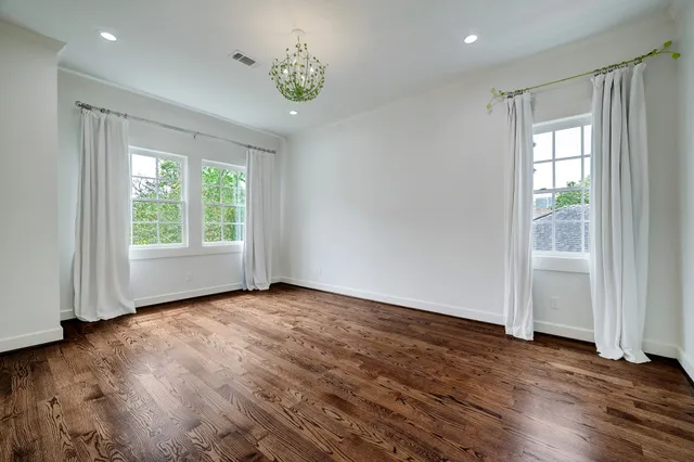a kitchen with granite countertop white cabinets and a sink