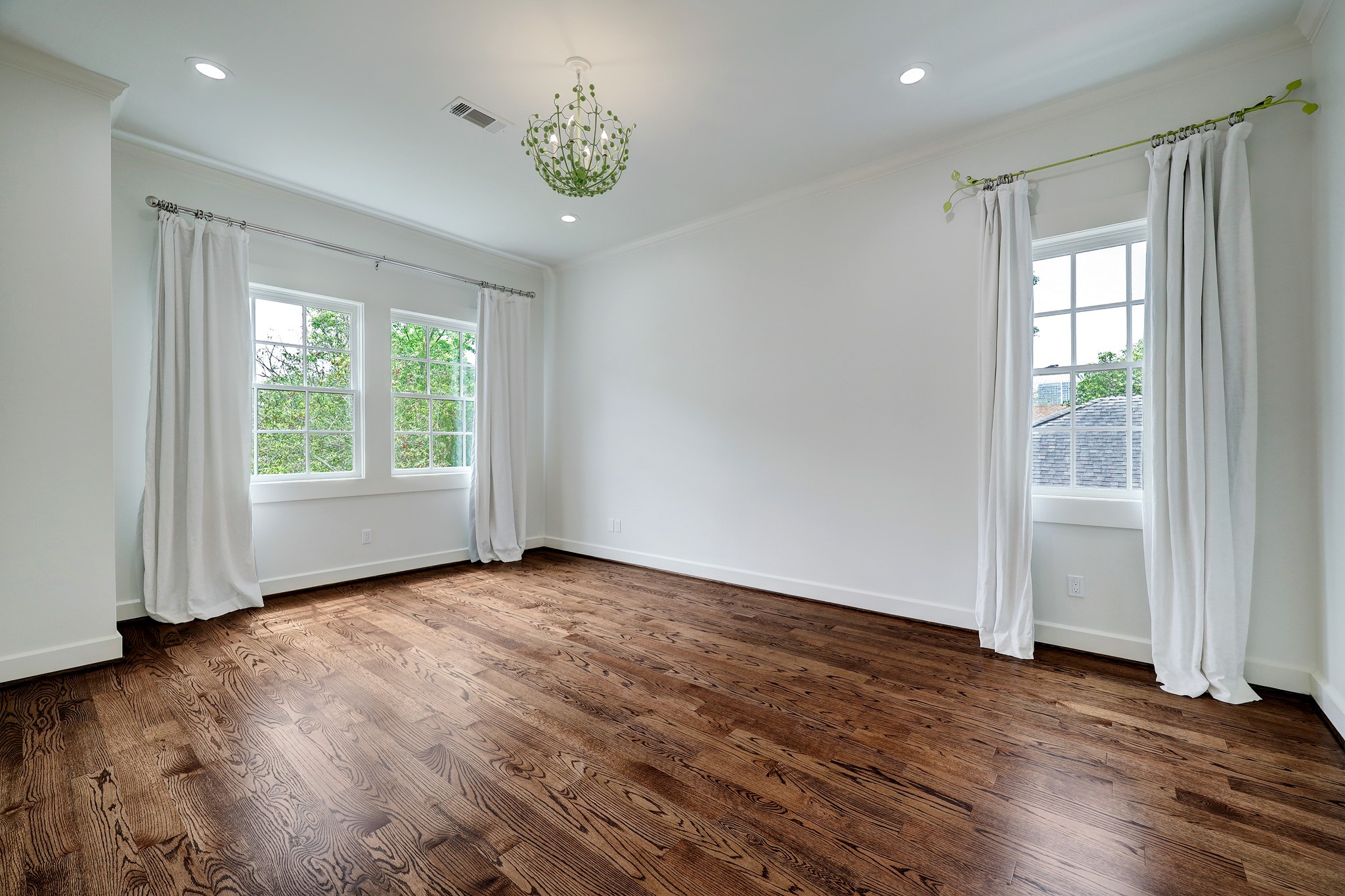 2027 Branard Street Houston, TX 77098 - Photo 24 of 36 an empty room with wooden floor and window