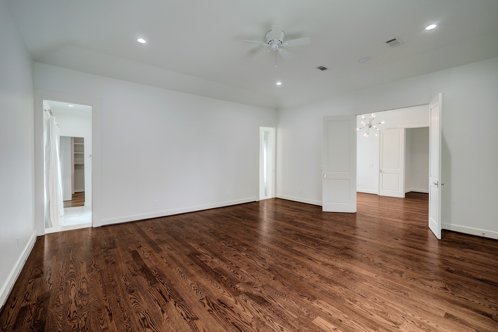 2027 Branard Street Houston, TX 77098 - Photo 29 of 36 a view of empty room with wooden floor and window
