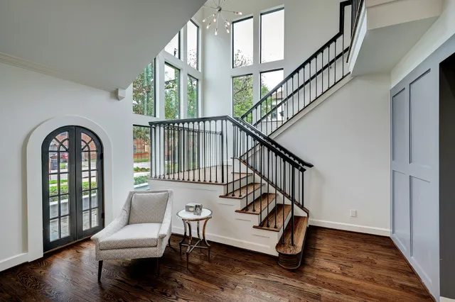 a view of entryway with wooden floor and door