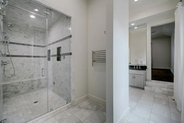 a kitchen with stainless steel appliances granite countertop a stove and a wooden floor