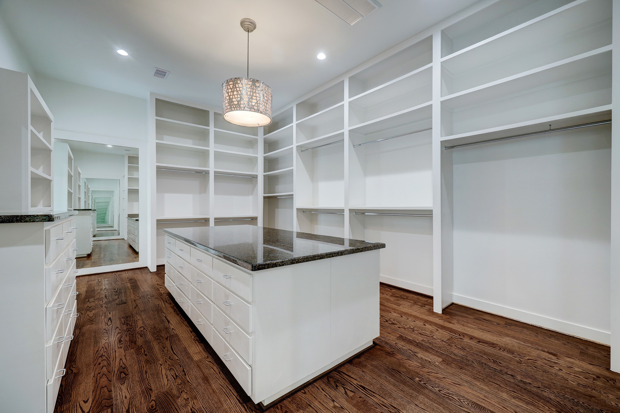 2027 Branard Street Houston, TX 77098 - Photo 33 of 36 a kitchen with stainless steel appliances granite countertop a stove and a wooden floor