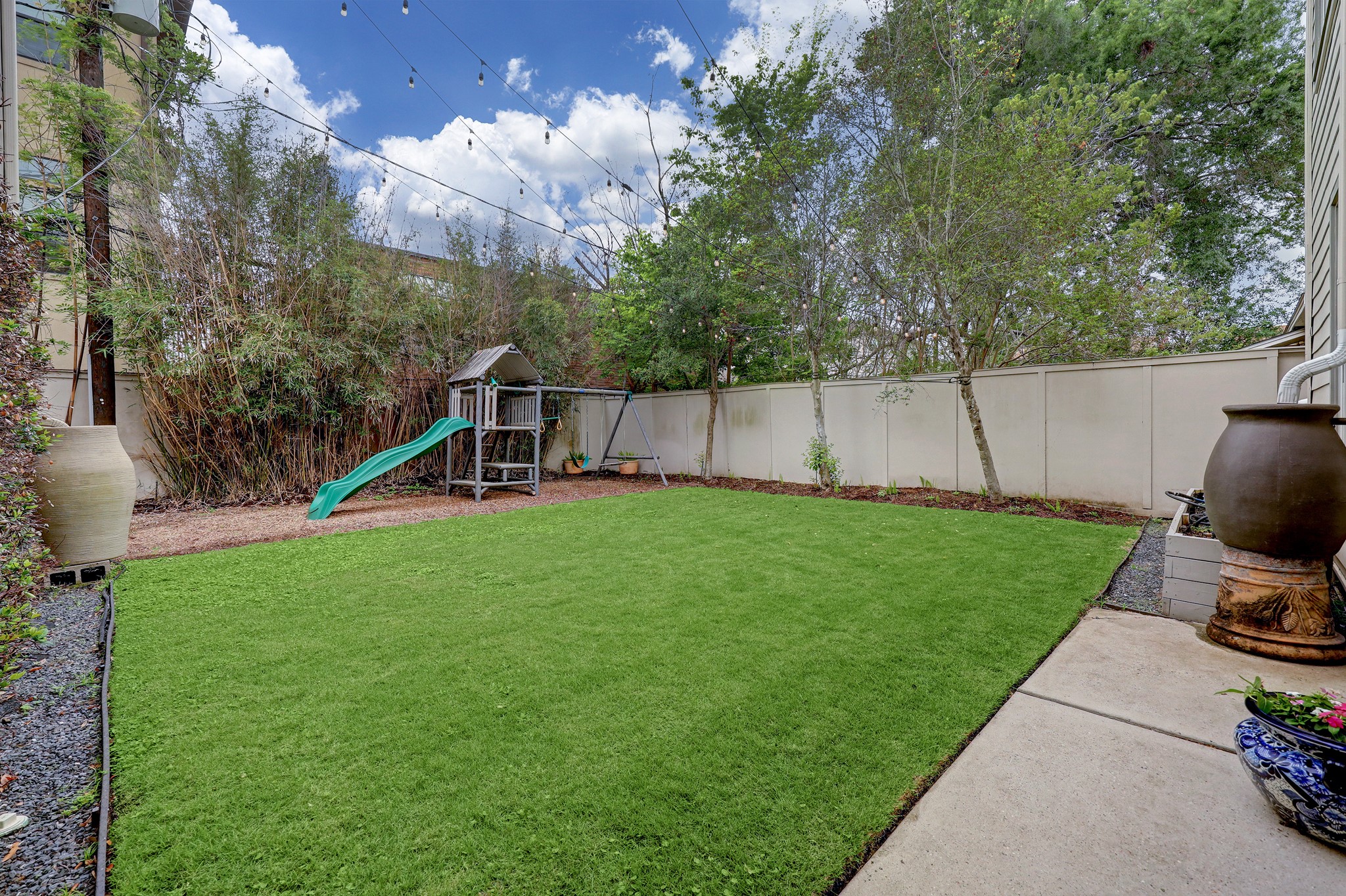 2027 Branard Street Houston, TX 77098 - Photo 34 of 36 a view of a house with backyard and a slide