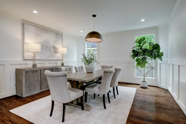 a dining room with furniture and window