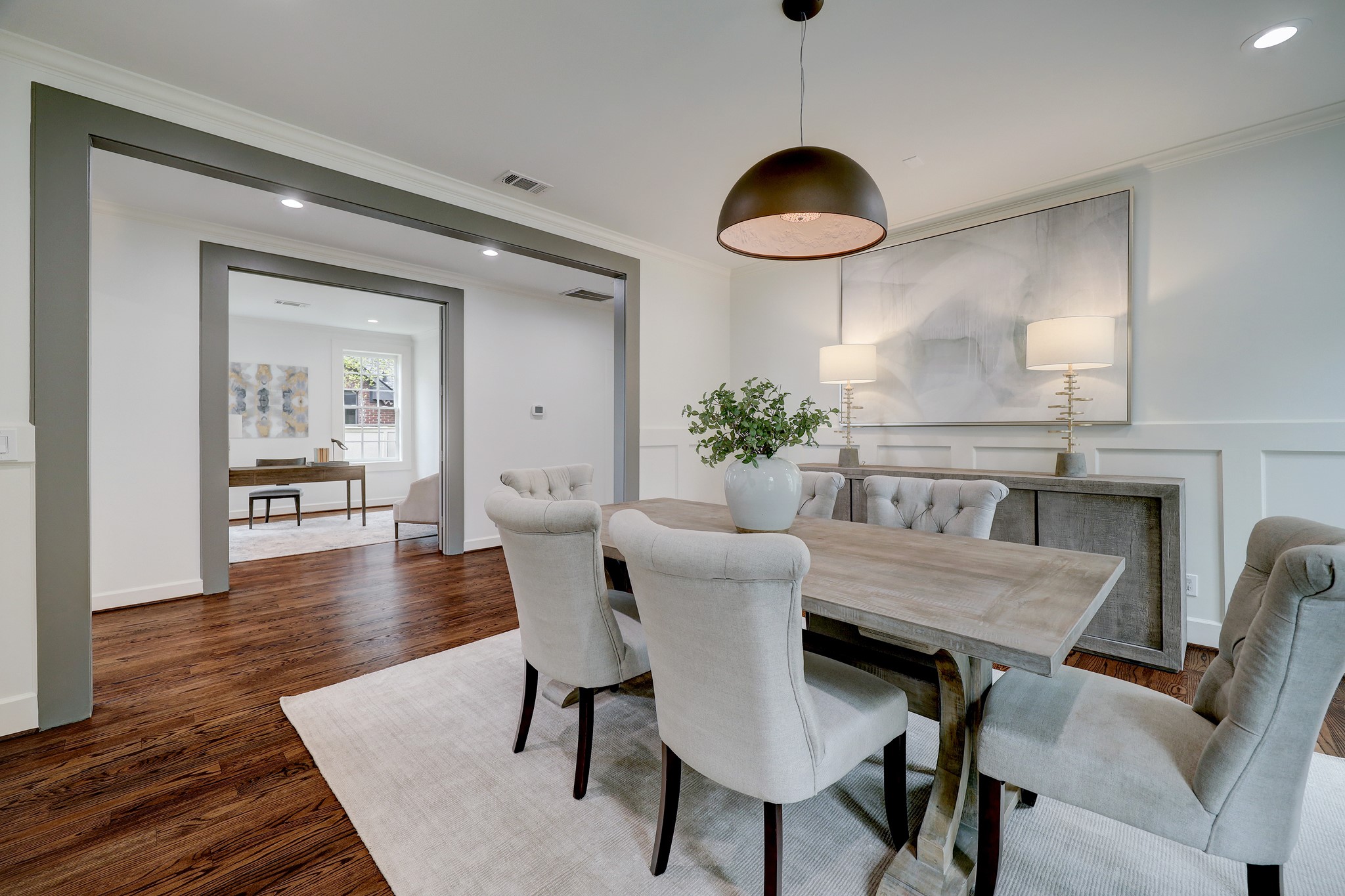 2027 Branard Street Houston, TX 77098 - Photo 9 of 36 a view of a dining room with furniture and wooden floor