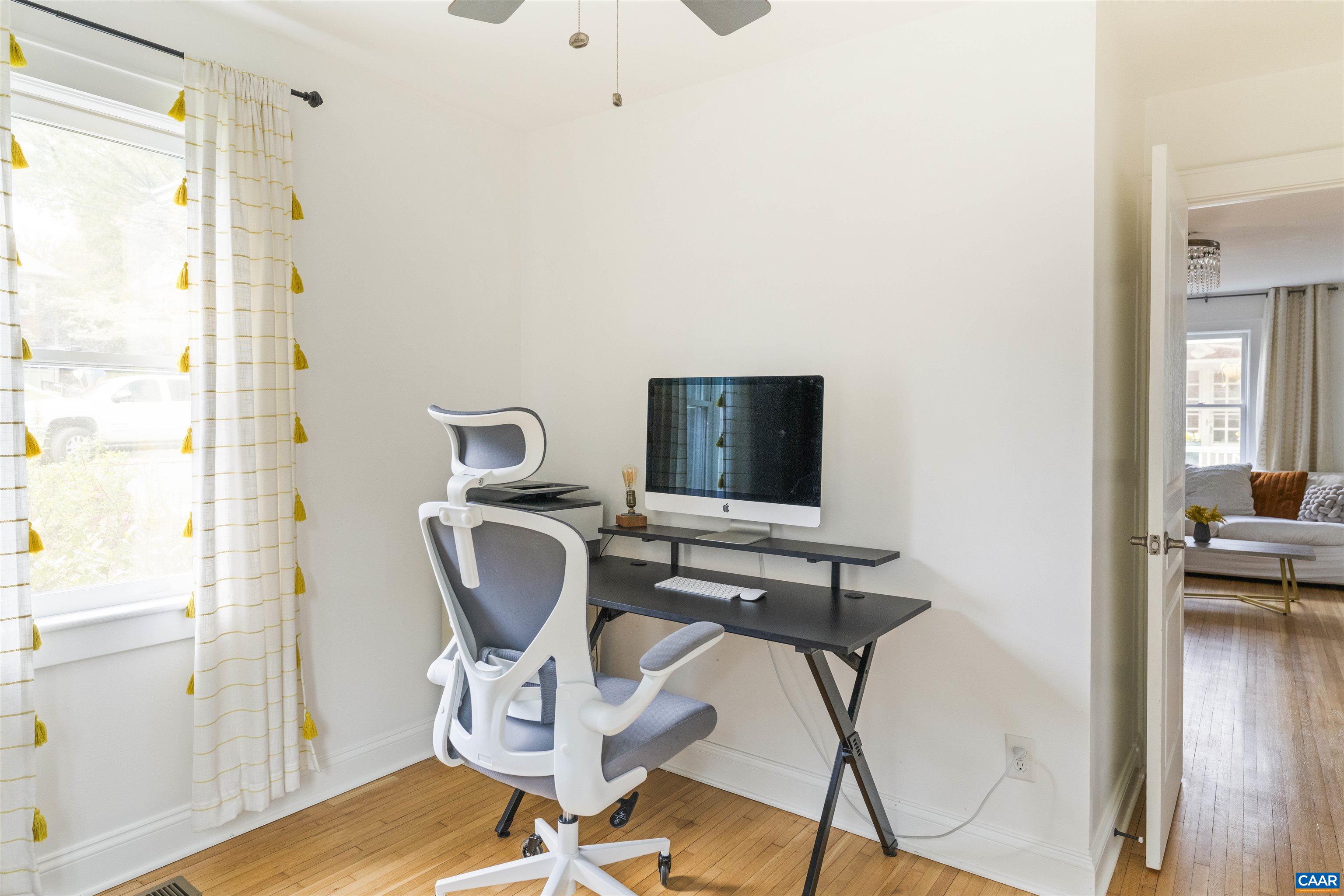 738 Lexington Avenue Charlottesville, VA 22902 - Photo 13 of 34 a view of a workspace with furniture and a window