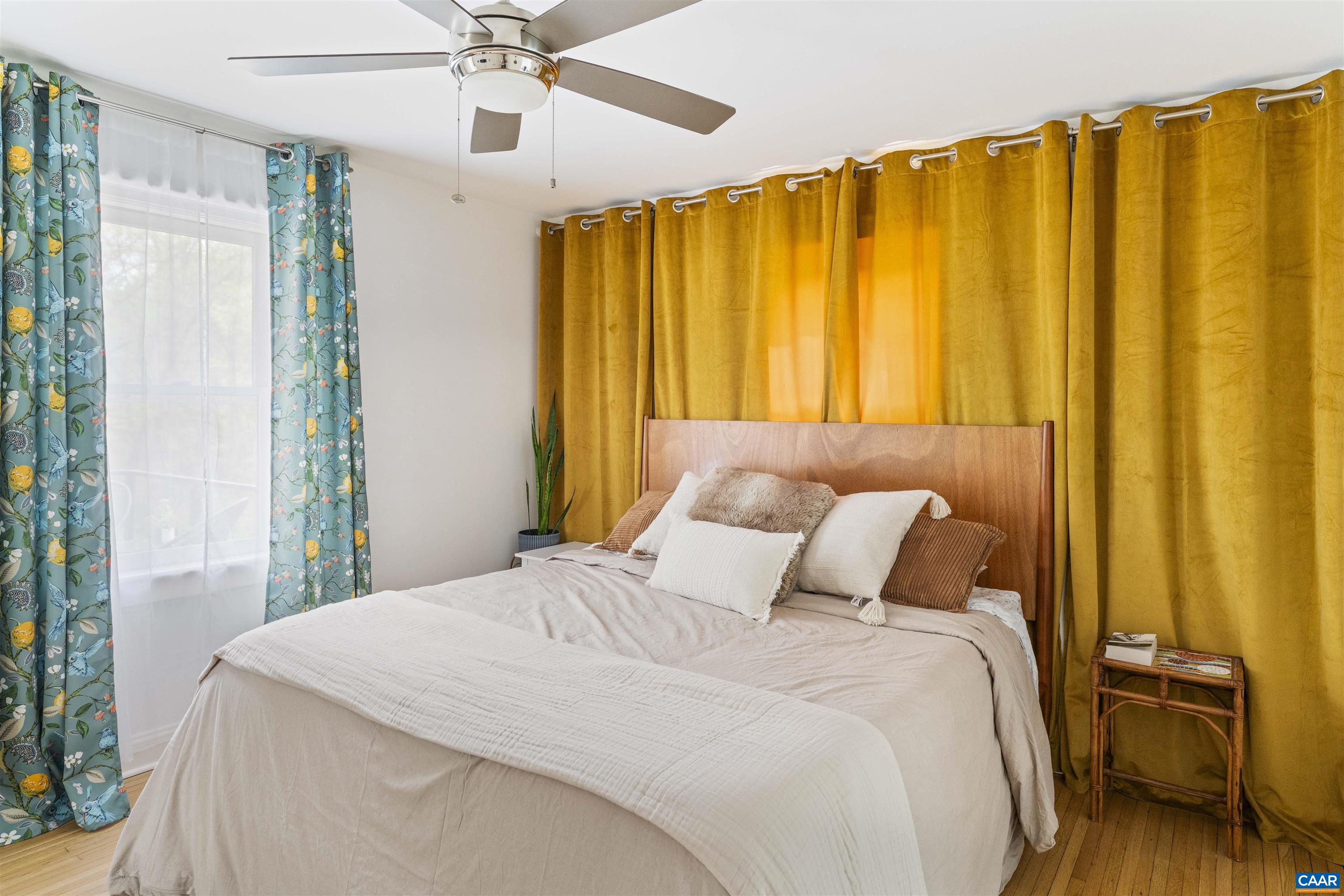 738 Lexington Avenue Charlottesville, VA 22902 - Photo 17 of 34 a bedroom with a bed and a chandelier