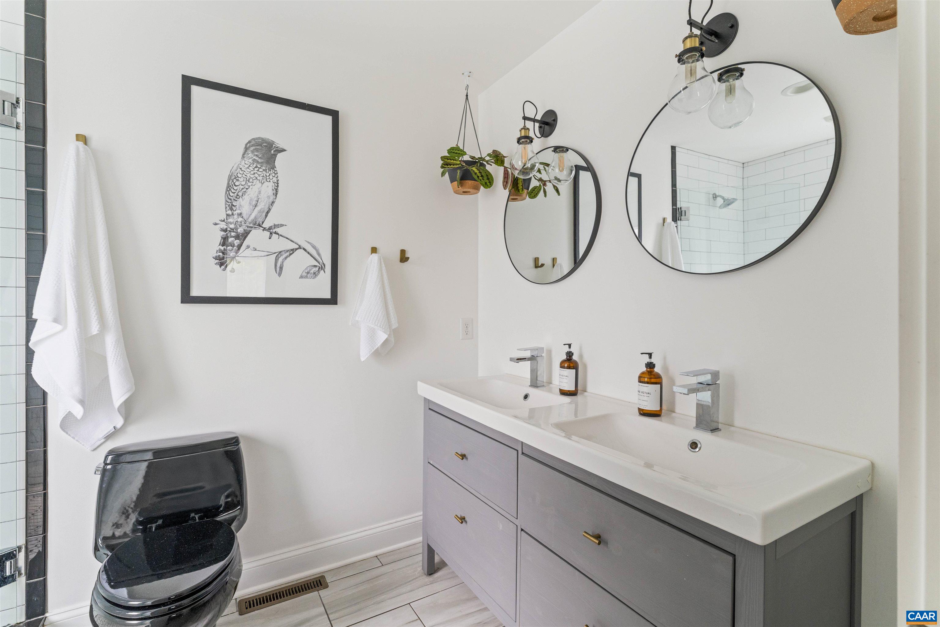 738 Lexington Avenue Charlottesville, VA 22902 - Photo 18 of 34 a bathroom with a sink and a mirror