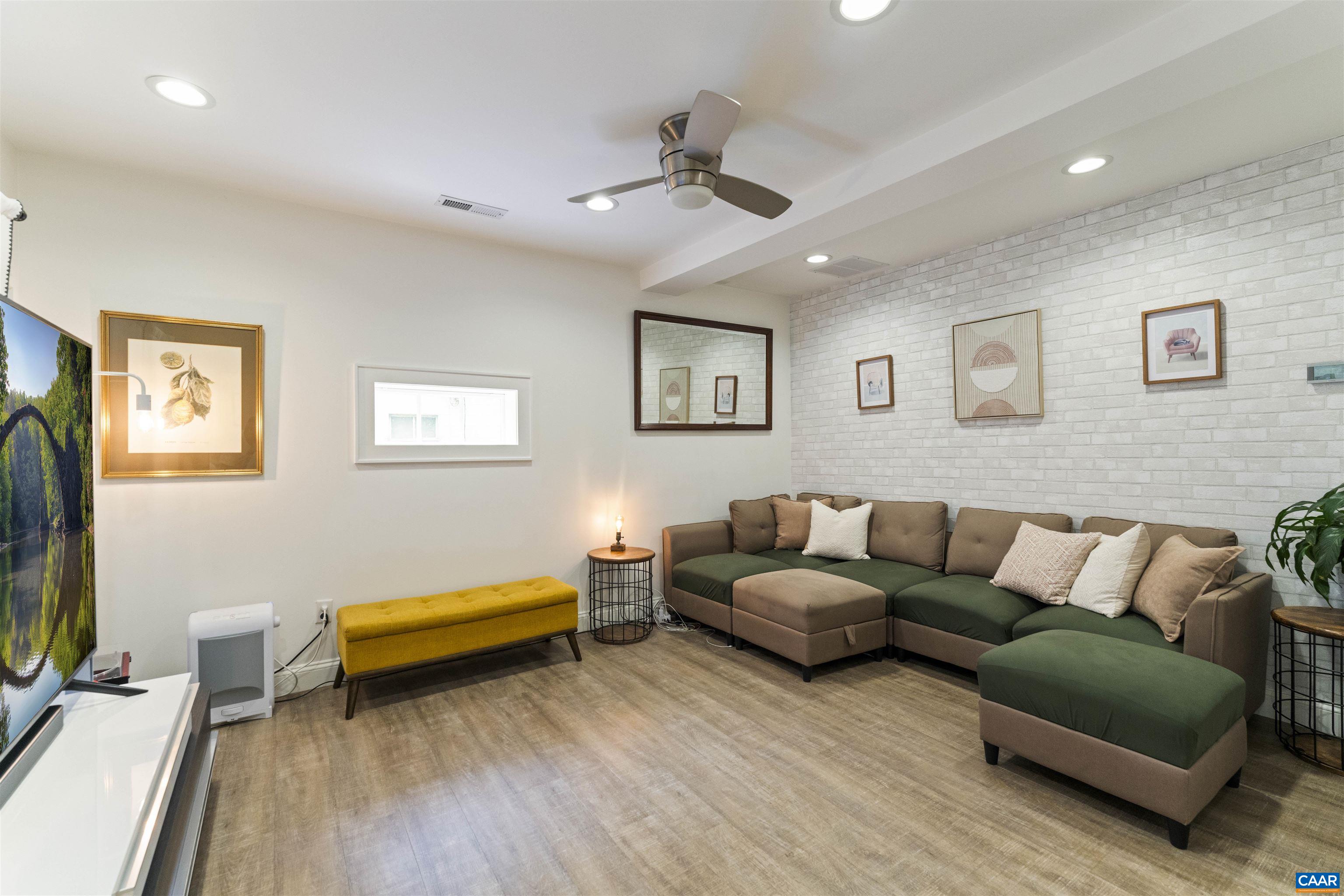 738 Lexington Avenue Charlottesville, VA 22902 - Photo 20 of 34 a living room with furniture and a flat screen tv
