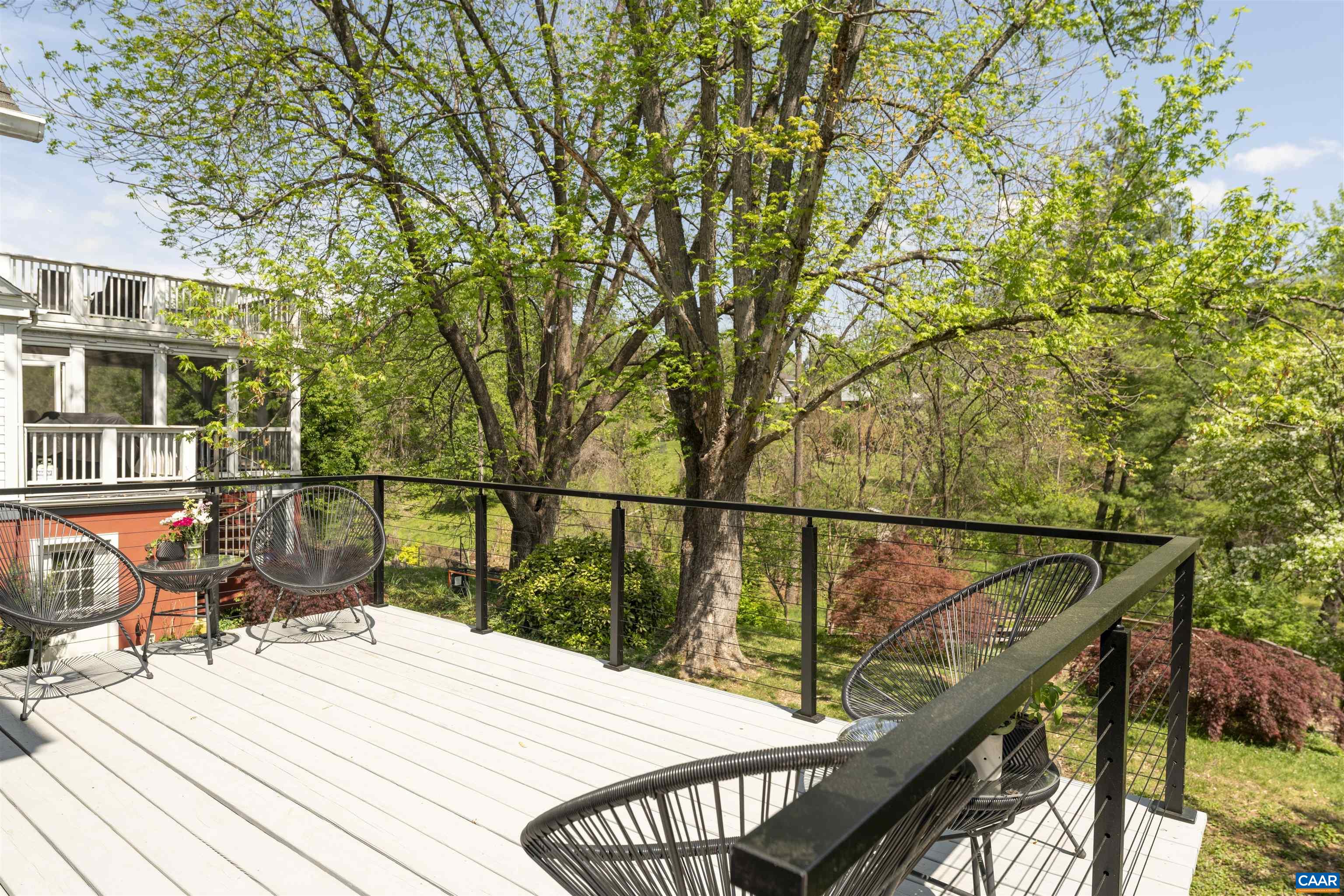 738 Lexington Avenue Charlottesville, VA 22902 - Photo 5 of 34 a view of a balcony with wooden floor and seating