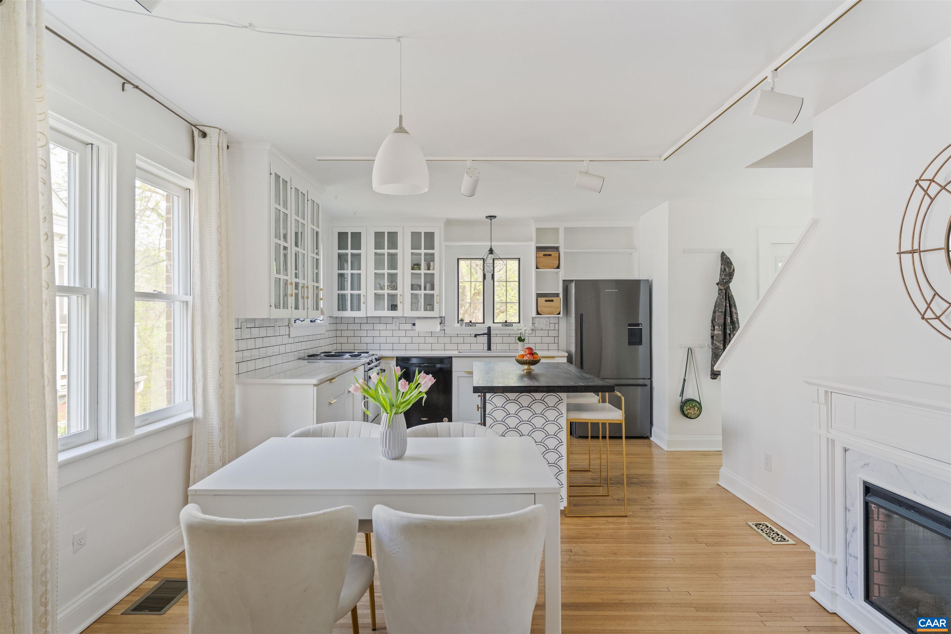 738 Lexington Avenue Charlottesville, VA 22902 - Photo 10 of 34 a living room with stainless steel appliances kitchen island furniture and wooden floor