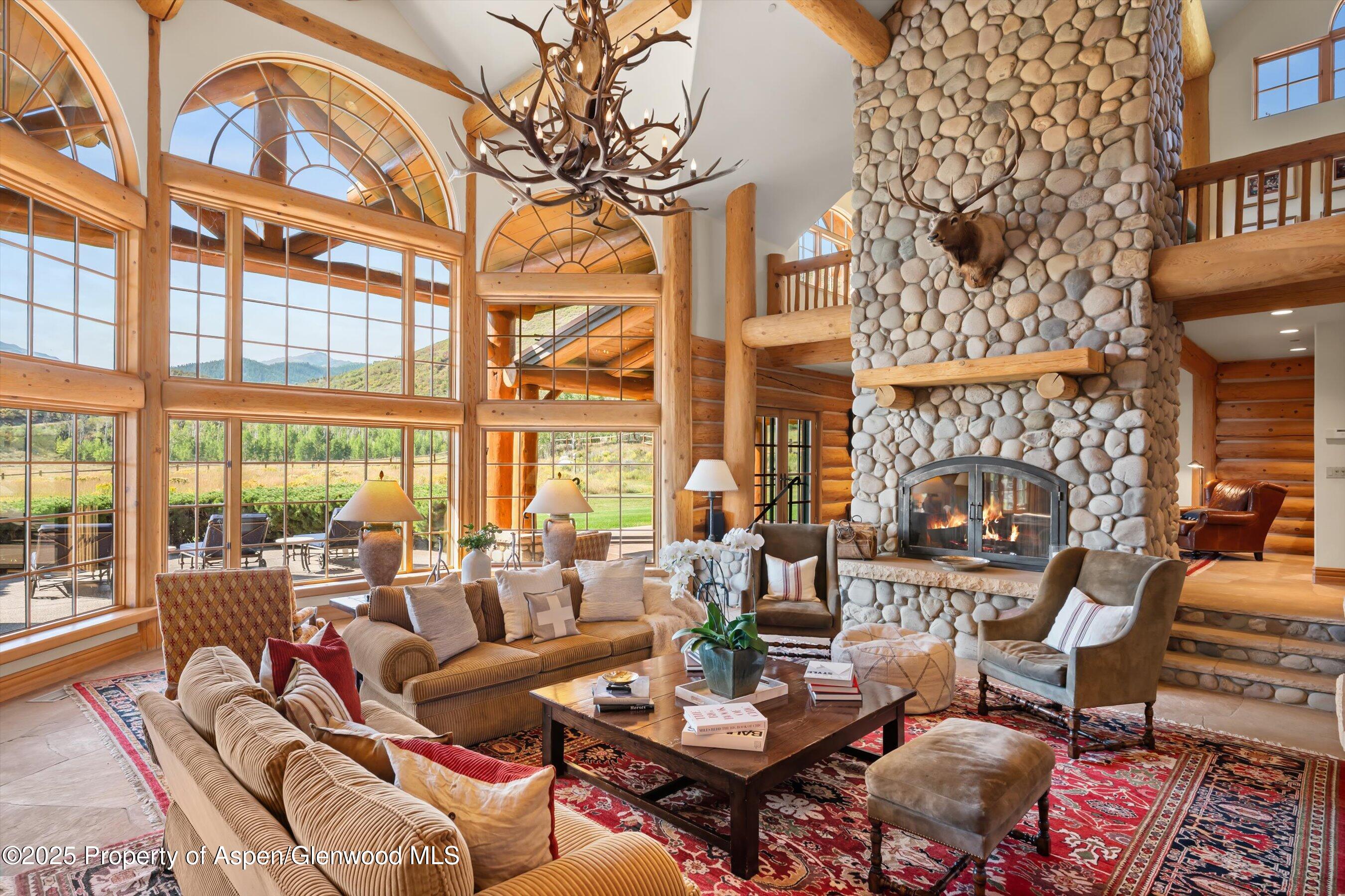 1301 Shield O Road Snowmass, CO 81654 - Photo 17 of 58 Great Room With Stone Fireplace