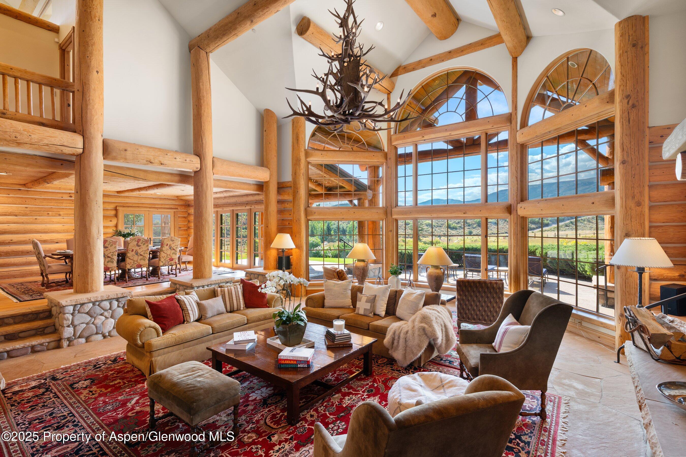 1301 Shield O Road Snowmass, CO 81654 - Photo 18 of 58 a living room with furniture and a large window with outer view