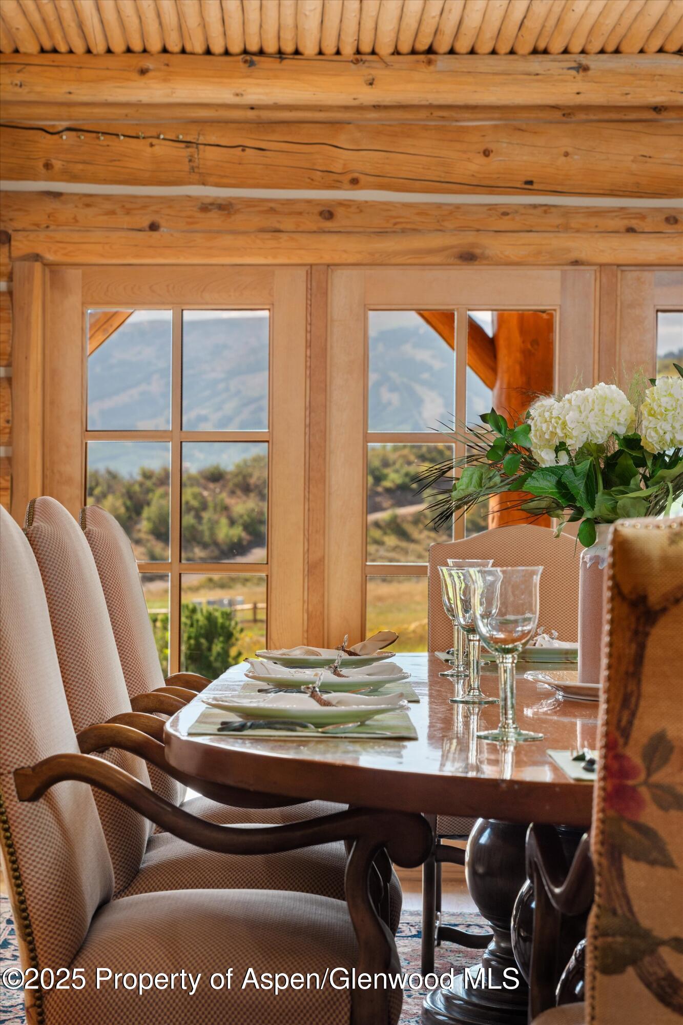 1301 Shield O Road Snowmass, CO 81654 - Photo 21 of 58 a view of a dining room with furniture window and outside view
