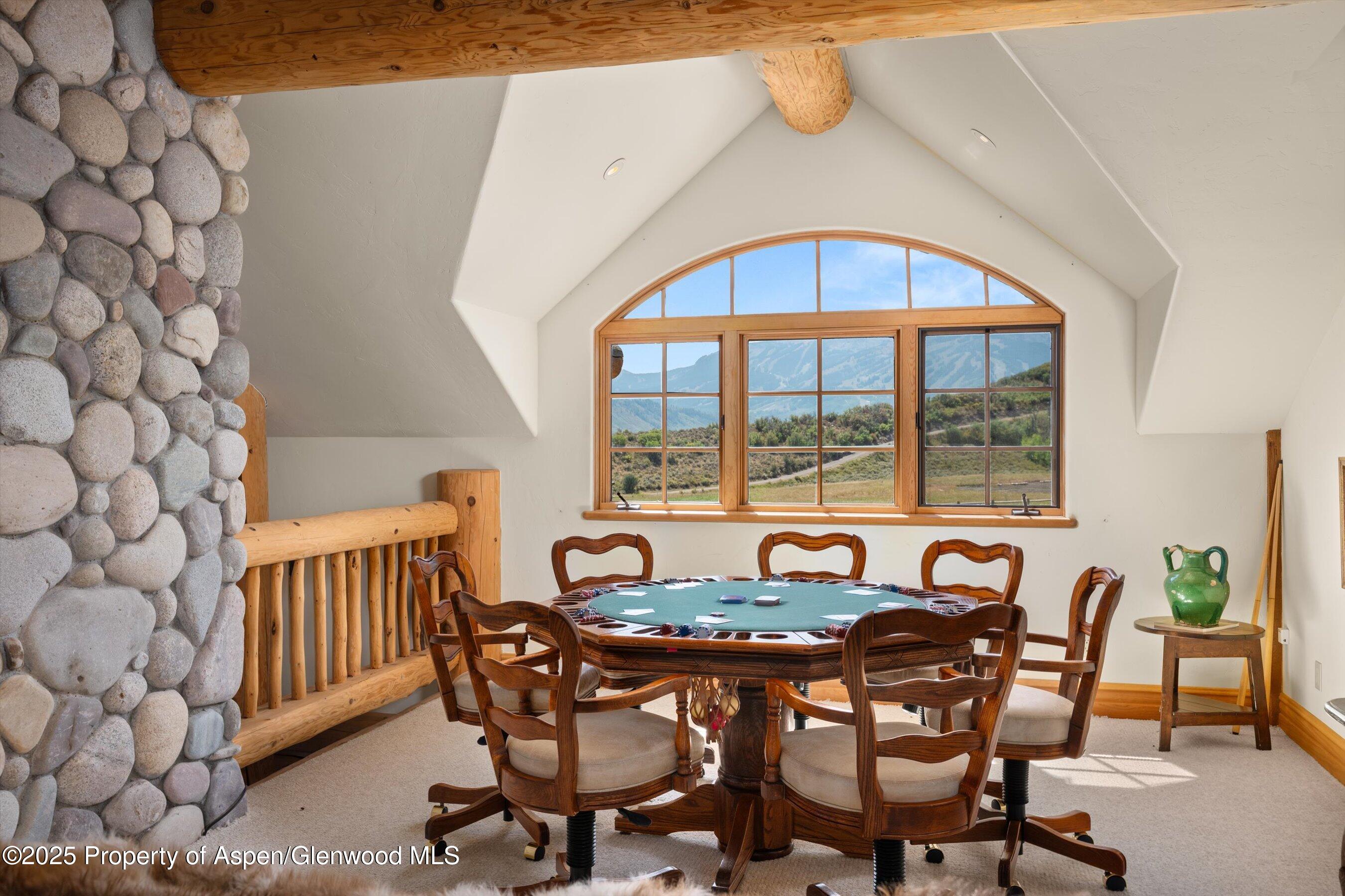 1301 Shield O Road Snowmass, CO 81654 - Photo 38 of 58 a dining room with furniture window and outside view
