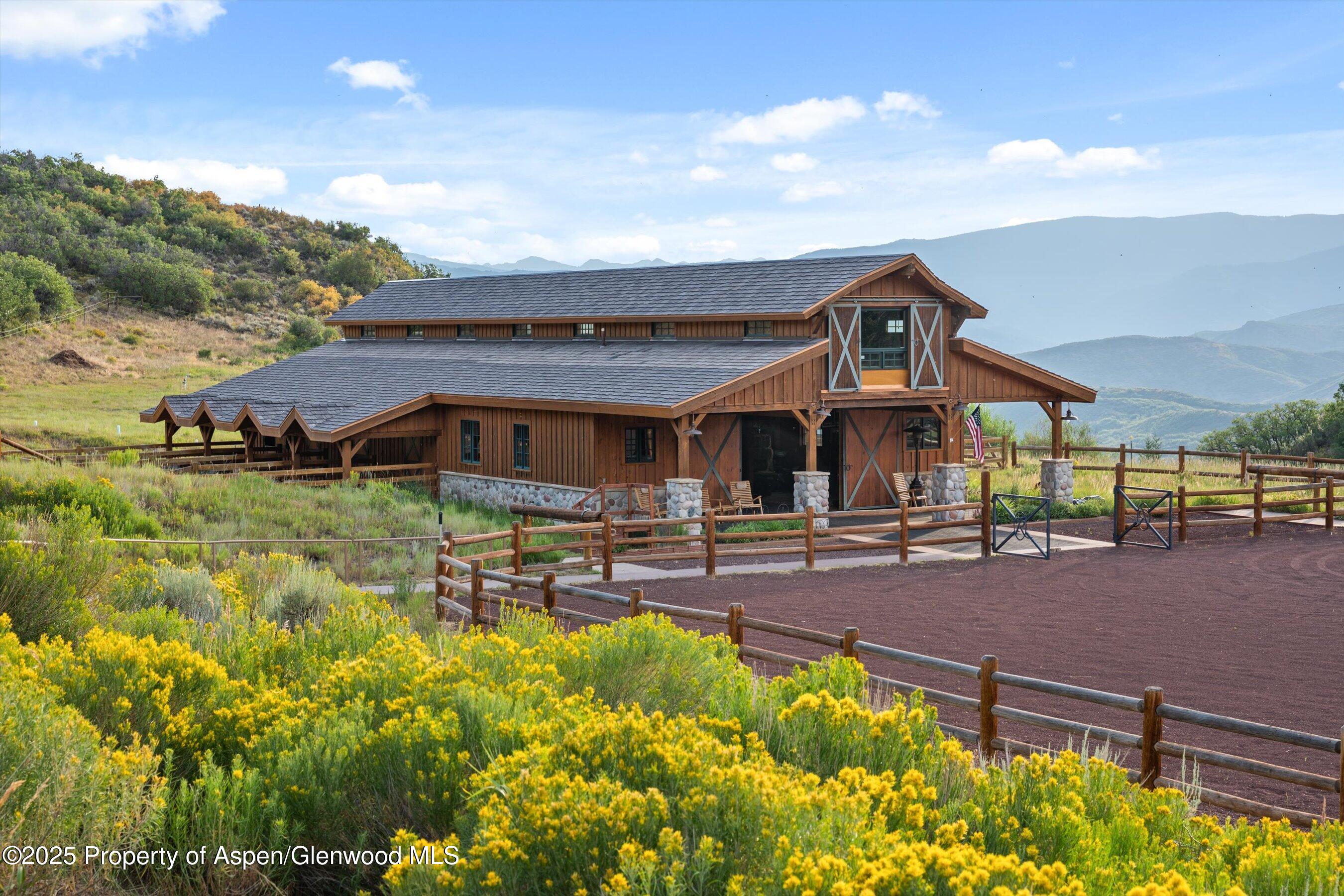 1301 Shield O Road Snowmass, CO 81654 - Photo 4 of 58 a front view of house with yard and seating area