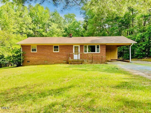 480 Peed Road Rougemont, NC 27572 - Photo 1 of 38 a front view of a house with yard and green space