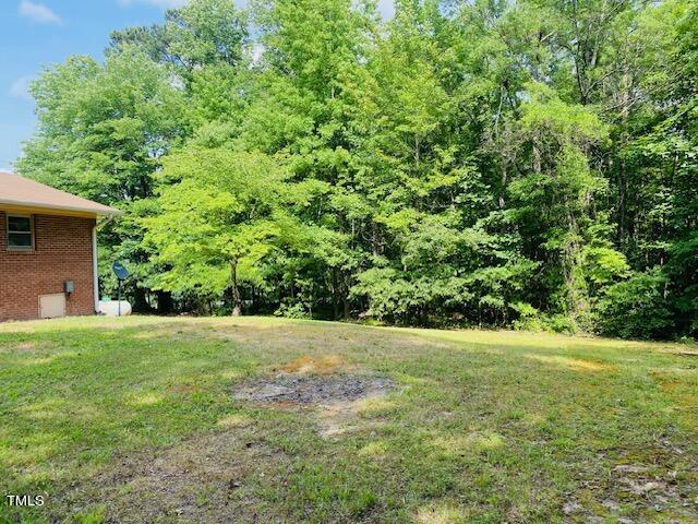 480 Peed Road Rougemont, NC 27572 - Photo 11 of 38 a view of a big yard with plants and large trees