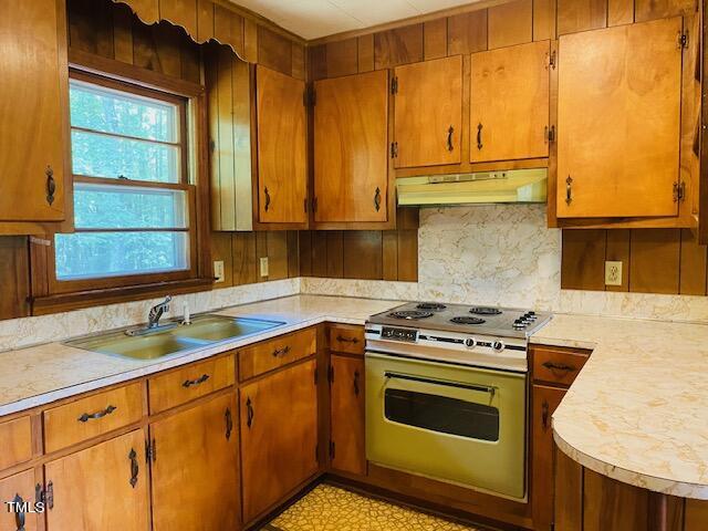 480 Peed Road Rougemont, NC 27572 - Photo 17 of 38 a kitchen with stainless steel appliances granite countertop a stove a sink and a microwave