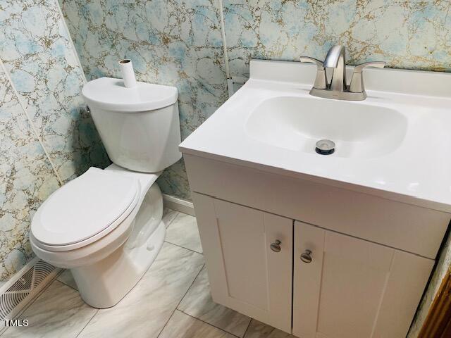 480 Peed Road Rougemont, NC 27572 - Photo 19 of 38 a white toilet sitting next to a bathroom sink