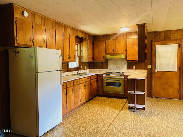 480 Peed Road Rougemont, NC 27572 - Photo 30 of 38 a kitchen with stainless steel appliances a stove a sink and a refrigerator
