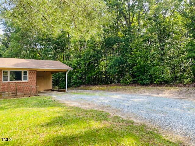 480 Peed Road Rougemont, NC 27572 - Photo 3 of 38 a backyard of a house with table and chairs