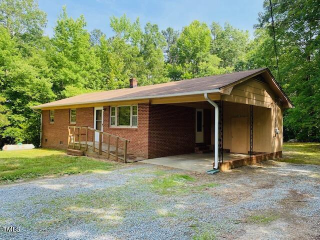 480 Peed Road Rougemont, NC 27572 - Photo 7 of 38 a view of a house with backyard and a tree