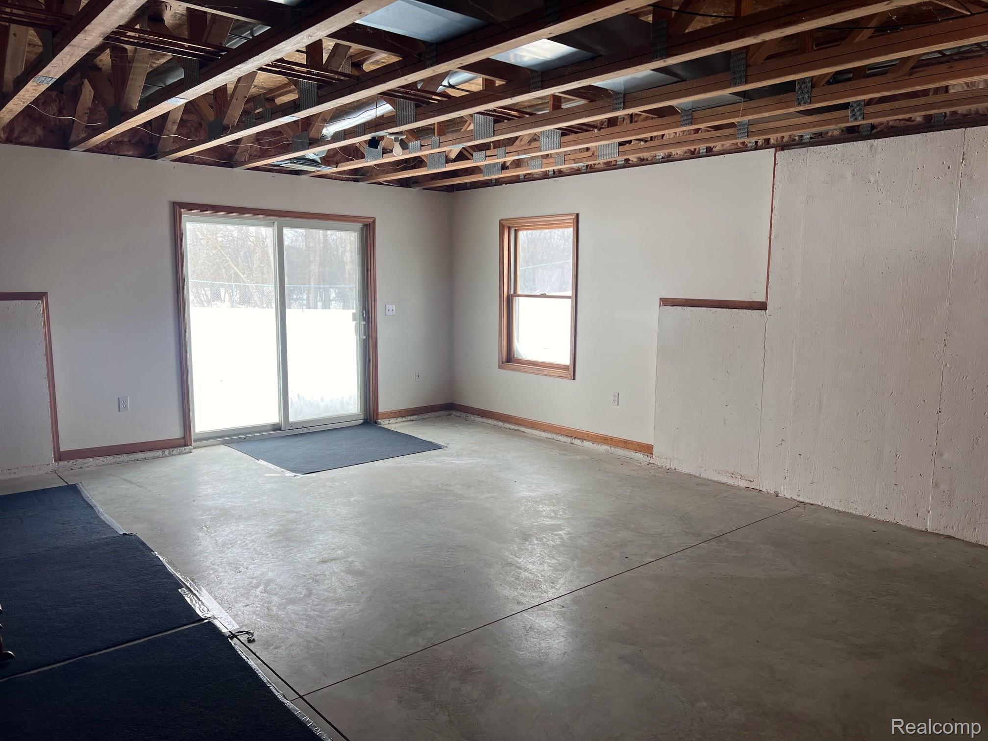 651 East Beard Road Perry, MI 48872 - Photo 17 of 29 Spare room featuring unfinished concrete flooring