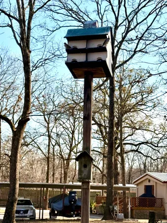a street sign on a pole next to a road